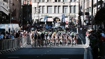 photo of cyclist on road