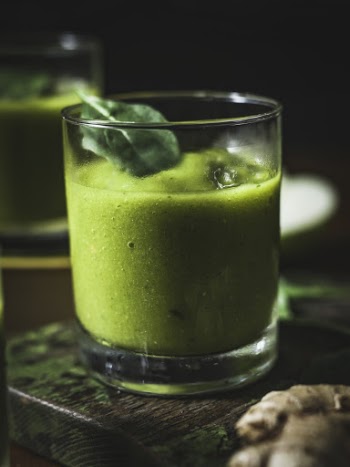 Photo of Drinking Glass Filled With Green Liquid