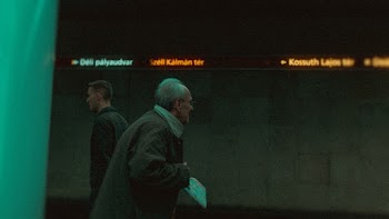 Photo of Elderly Man Walking in Subway Station