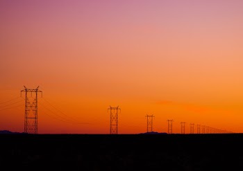 Photo of Electric Posts During Sunset