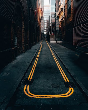 Photo of Empty Alley in Between Buildings
