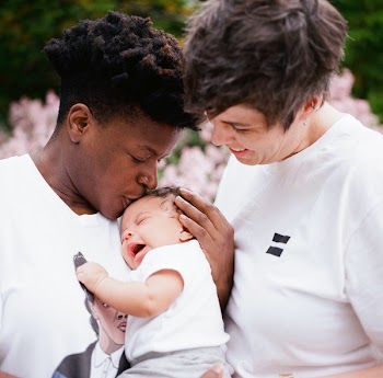 Photo of Family in White Shirts Shallow Focus Photography