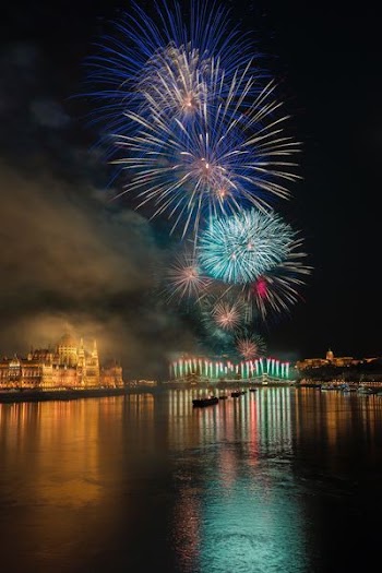 photo of fireworks above body of water