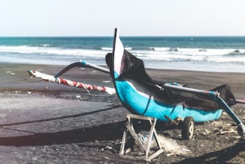 Photo of Fishing Boat on Shore During Daytime