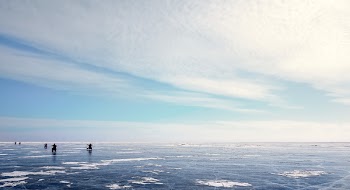 Photo of Five People on Ice Field