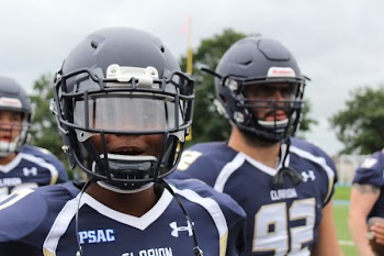 Photo of Football Players in Blue Uniform