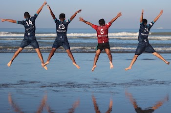 Photo of Four Men on Water