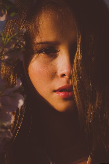 Photo of Girl Beside Flowers