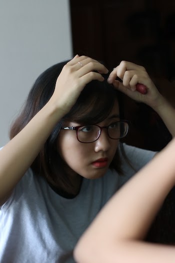 Photo of Girl Holding Her Hair