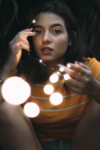 Photo of Girl Holding String Light