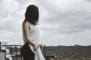 Photo of Girl Leaning On Handrail