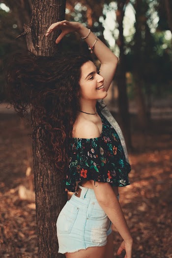 Photo of Girl Leaning On Tree