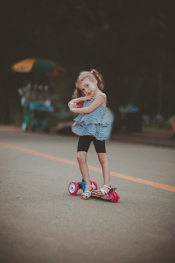 Photo of Girl Riding Trolley
