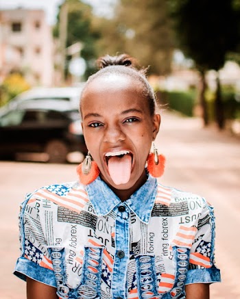 Photo of Girl Showing Her Tongue