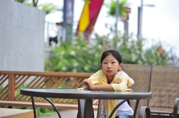 Photo of Girl Sitting on Chair