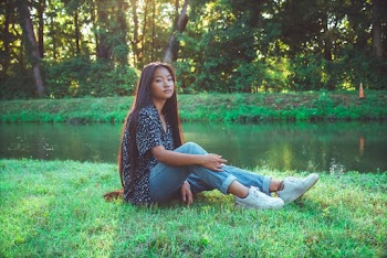 Photo of Girl Sitting on Grass