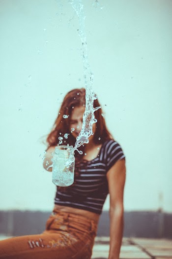 Photo of Girl Throwing Water