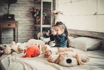 Photo of Girl Using Camera