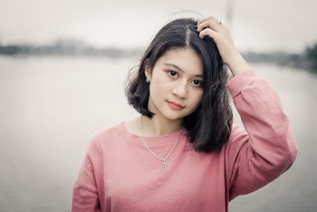 Photo of Girl Wearing Pink Sweater