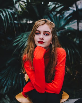 Photo of Girl Wearing Red Sweater