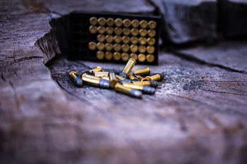 Photo of Gold Ammunitions on Wood