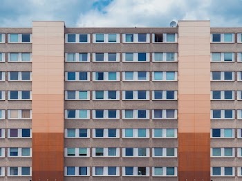 photo of gray and brown high-rise building