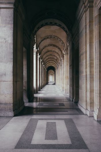 photo of gray hallway during daytime