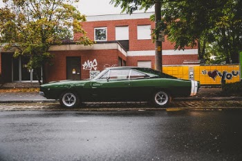 Photo Of Green Coupe Parked On Pavement