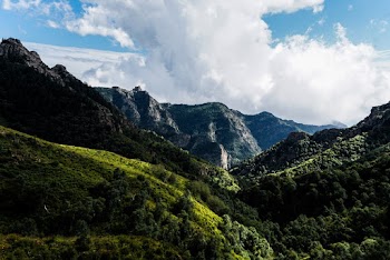 Photo of Green Mountains Under Cloudy Sky