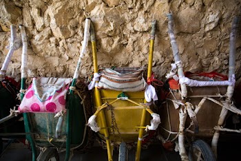 Photo of Green, Yellow, and Brown Wheelbarrows
