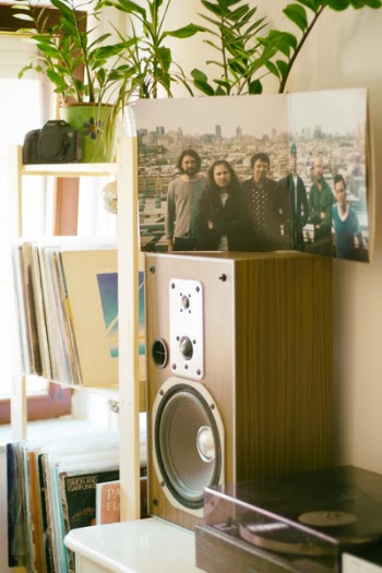 Photo of Group of Men on Top of Brown Speaker