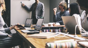 Photo of Group of People in a Meeting