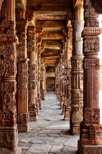 Photo of Hallway of Brown Stone Columns