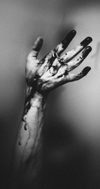 Photo of Hand with Dark Paint