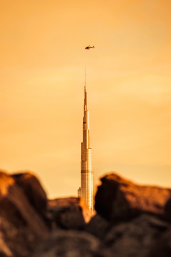 Photo of Helicopter Flying Over Burj Khalifa