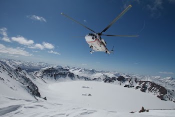 photo of helicopter in middle of sky