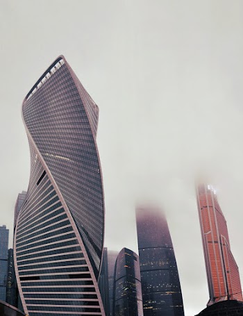 Photo of High-rise Buildings on a Foggy Day