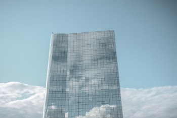 Photo of High-rise Glass Building Under Blue Sky