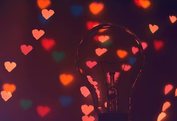Photo of Illuminated Hearts Around the Light Bulb