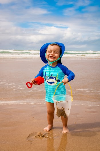 Photo of Kid Playing on Seashore
