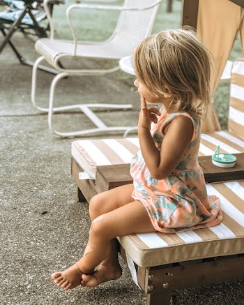 Photo Of Kid Sitting On A Chair