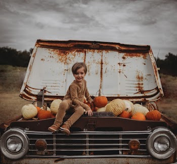 Photo Of Kid Sitting On Truck
