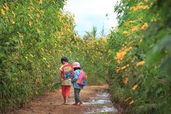 Photo Of Kids Walking On Dirt Road