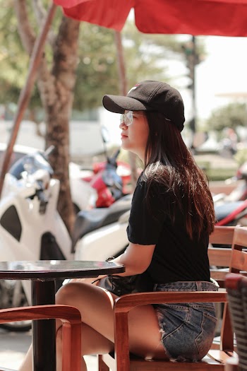 Photo Of Lady Wearing A Black Cap