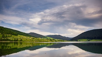 Photo of Lake Under Cloudy Sky