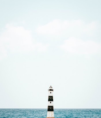 Photo Of Lighthouse Near Sea