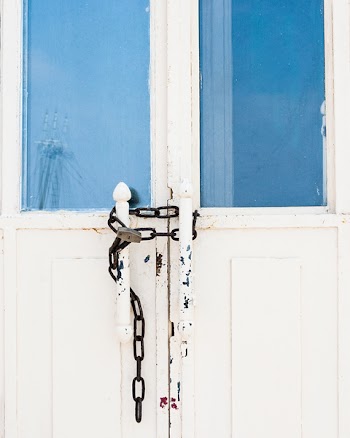 Photo of Locked White Door