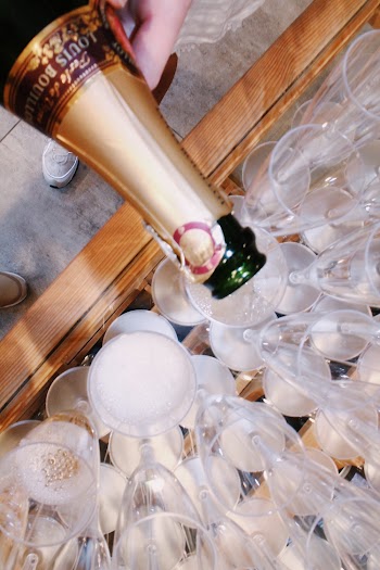 Photo of Louis Bouillot Wine in Bottle  Being Poured in Glasses