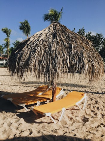Photo of Loungers Under Tiki Umbrella