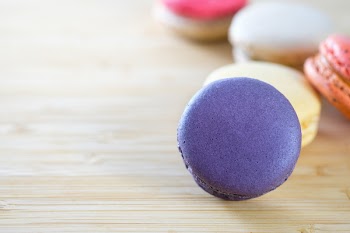 Photo of Macarons on Brown Wooden Surface